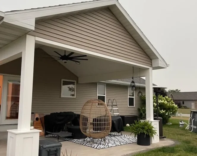 backyard porch with couch and grass